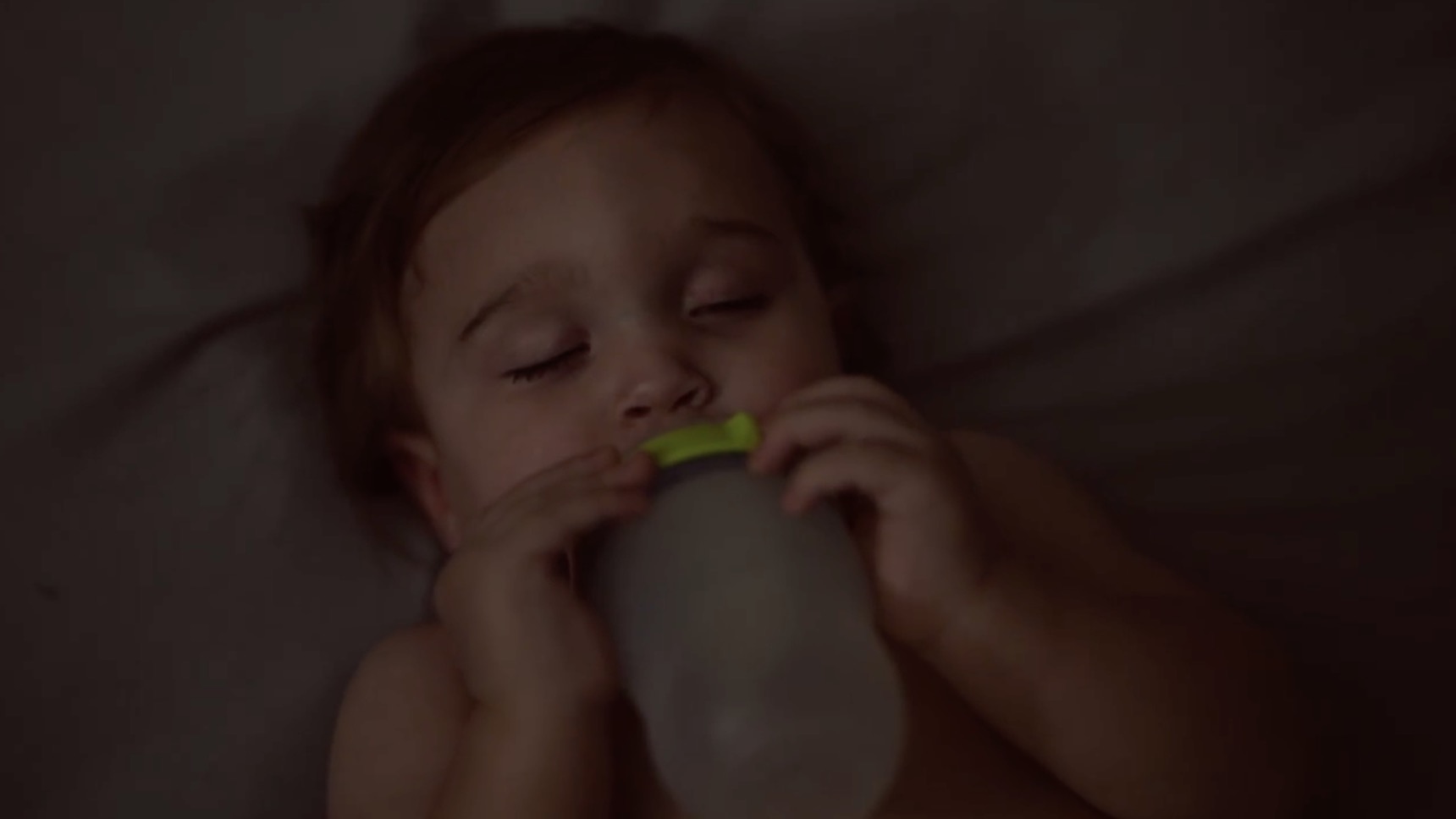 Sleeping child with bottle